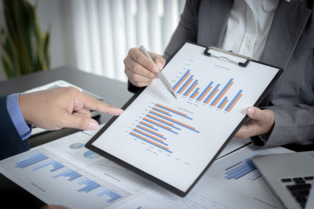 Colleagues Discussing Business Chart 